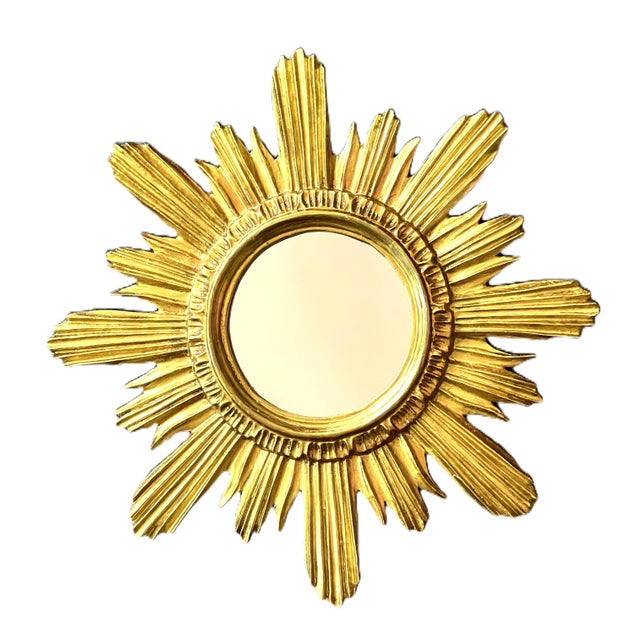 A striking mid-century german sunburst mirror by wenz, circa 1960. Featuring a beautifully sculpted giltwood frame with...