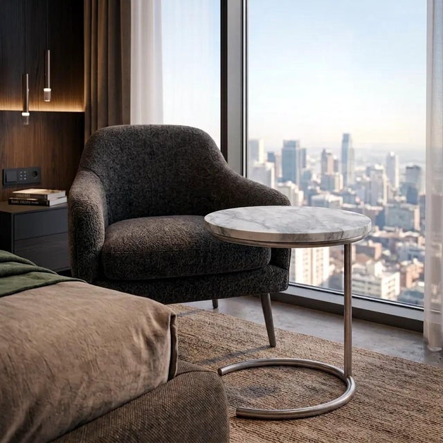 Defined by clean lines and tonal subtlety, this side table features a polished grey marble top with soft veining in ash,...