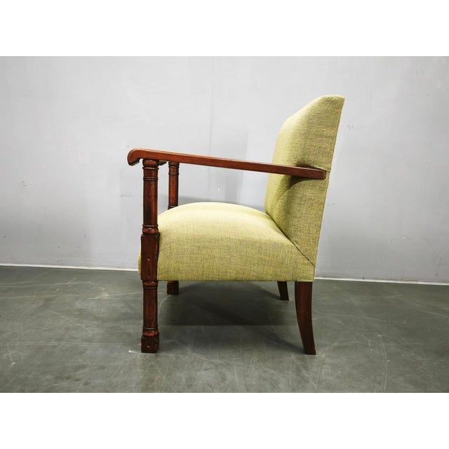 An elegant Art Deco armchair produced in Czechoslovakia between 1935 and 1945, showcasing the refined craftsmanship and...