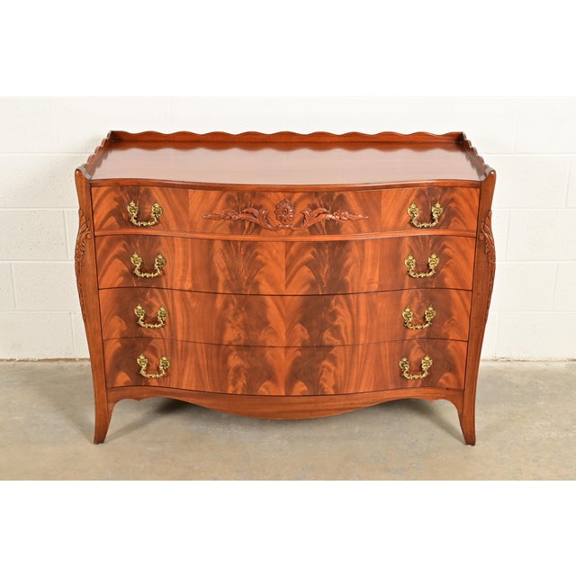 An exceptional French Regency Louis XVI or Georgian style serpentine front commode or chest of drawers In the manner of...