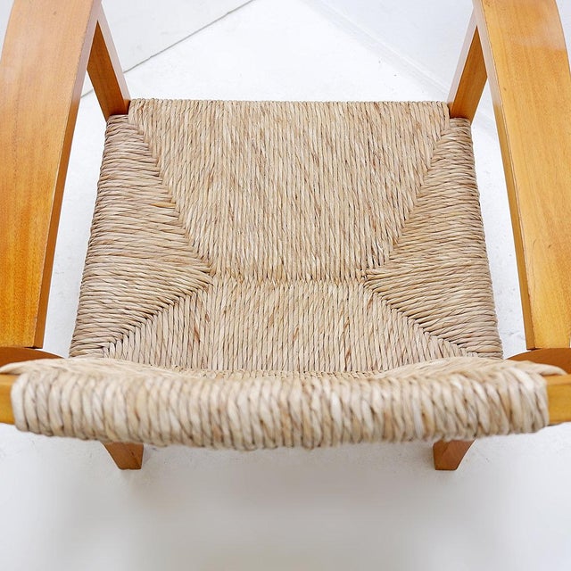 The armchair is an icon of 20th spanish design. measures : 72x80cm h:73cm sh:37cm materials : beechwood - woven rush...