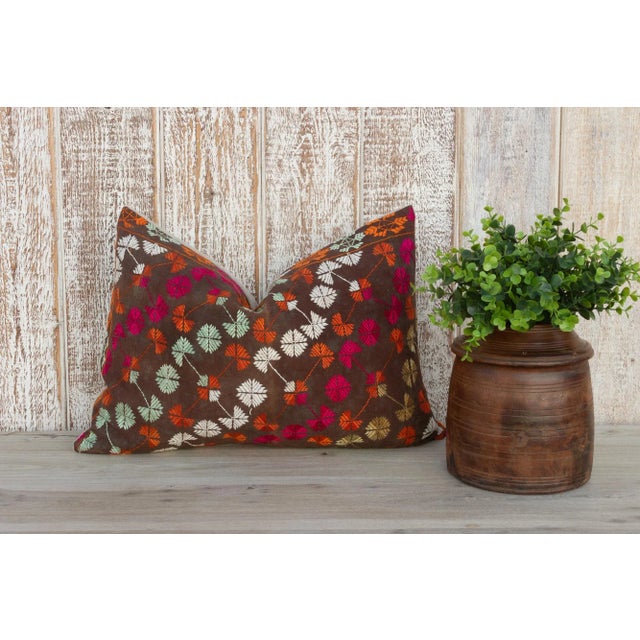 This colorful and luxurious Bagh Phulkari pillow features beautiful hand-done silk embroidery on top of a cotton fabric....