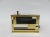 The cigarette dispenser was produced by Erhard & Söhne. It is made of brass, partially painted with enamel paint with a...