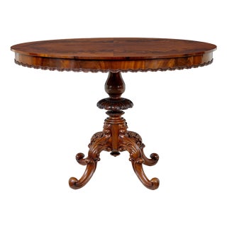 19th Century Carved Flame Mahogany Oval Center Table, 1890s For Sale