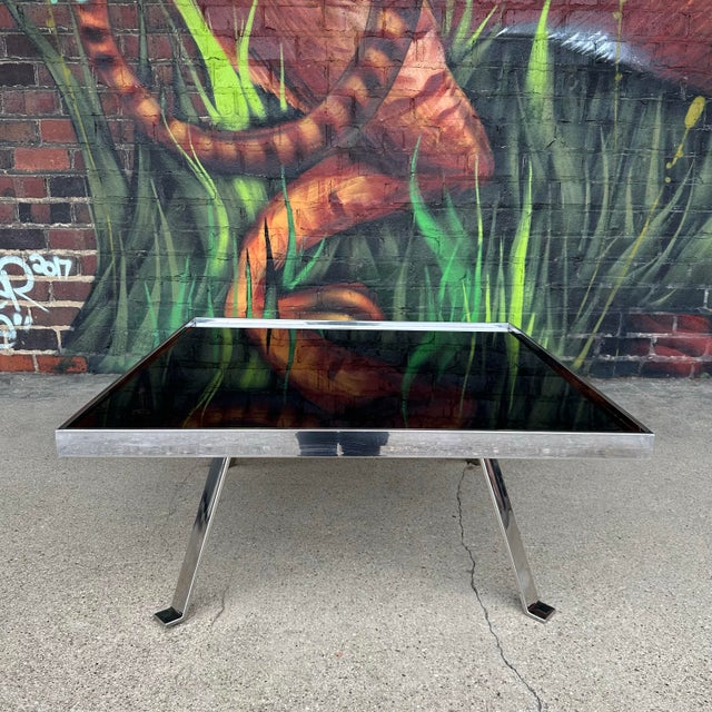 Italian Modernist coffee or cocktail table in the style of the Pace Collection. Beautiful polished aluminium frame,...