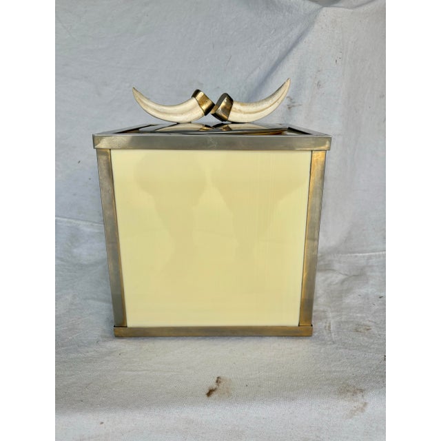 Found in Italy, this Mid 20th Century Ice Bucket was crafted in the mid 1900's. The piece features an off white body that...