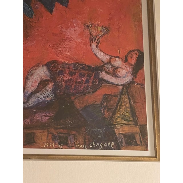 This Marc Chagall signed framed lithograph is a stunning piece of art measuring 34 x 39 inches. The surrealistic and...