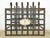 Hand forged wrought iron box shaped unit with a black finish and an ornate embellishment. The original use is unknown. It...