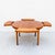 Dyrlund's iconic "Flip Flap" dining table features one of the most innovative expansion mechanisms in Danish Modern...
