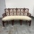 Design Plus Gallery presents a Chippendale Style Settee. This vintage settee has a carved wood frame with an open lattice...