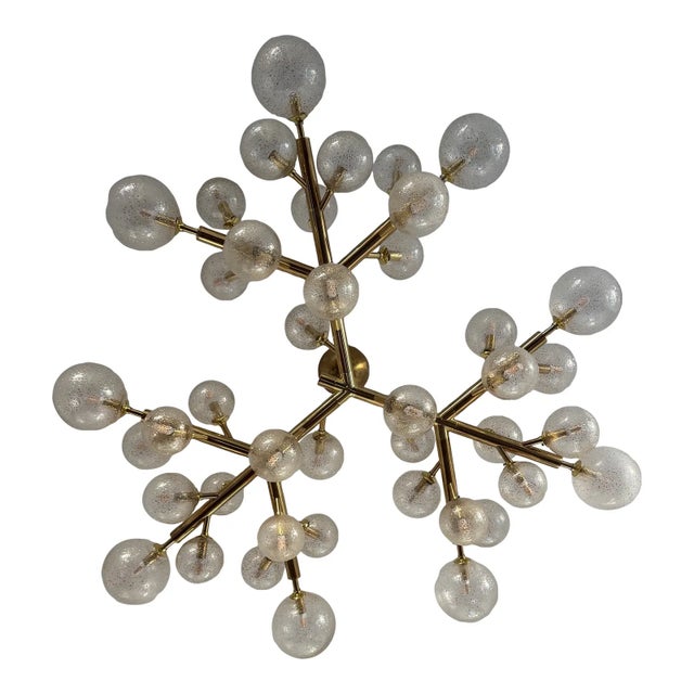 Design Plus Gallery presents the Mimosa Murano Glass Chandelier by Alberto Donà. This sculptural ceiling light is composed...