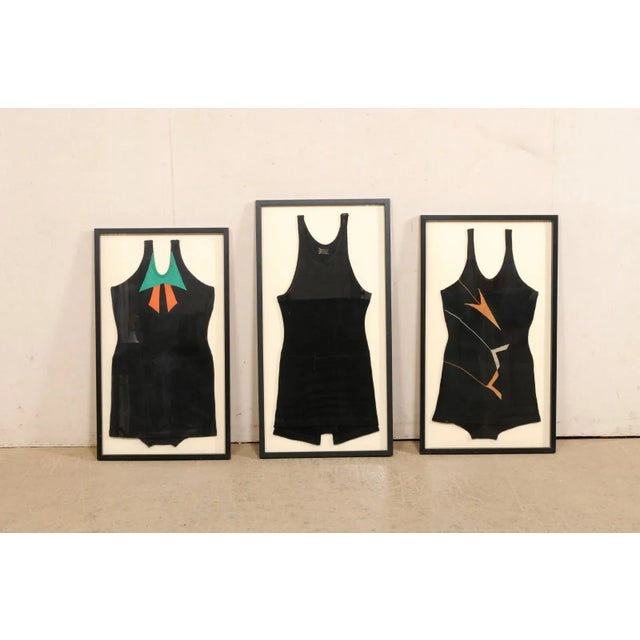 A set of three framed bathing suits from the 1920's. This collection of antique swimwear is comprised of two female...