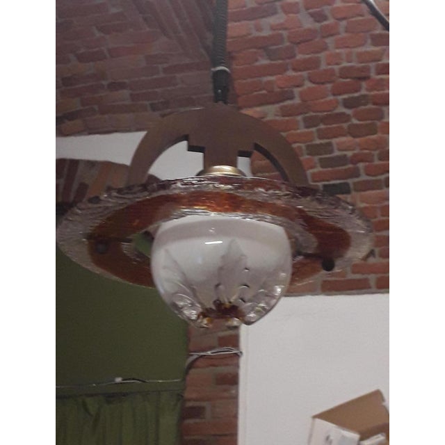 1960s chandelier, made of Murano glass with a wooden centerpiece. Beautiful colors. The glass part has no defects. The...