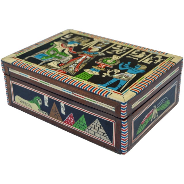 Vintage handcrafted box with intricate inlaid mother-of-pearl and fruitwood. Featuring an exquisite Egyptian symbols and...