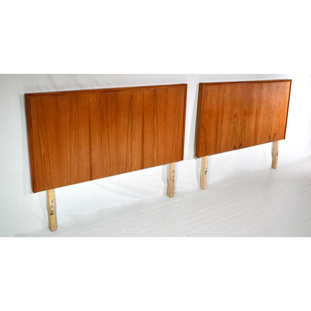 A pair of vintage Danish Modern twin headboards, nicely framed with striking wood grains, crafted in Canada in the 1970's....
