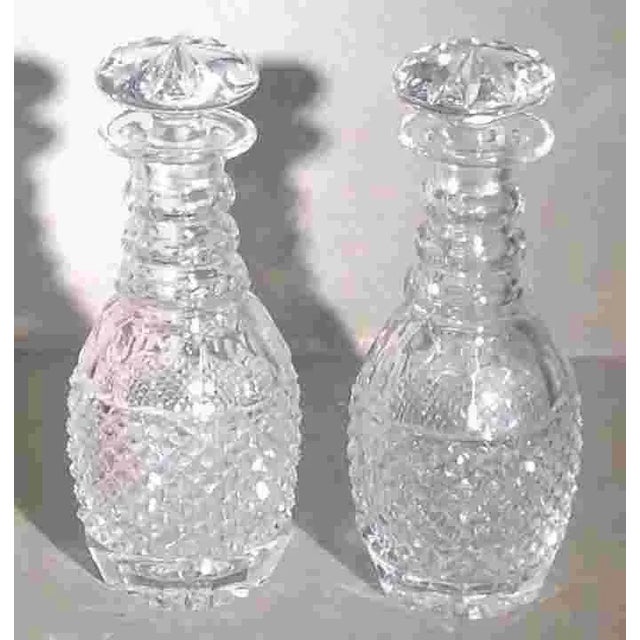 Diminutive pair of c. 1910 English cut glass decanters in excellent original condition and with original stoppers....