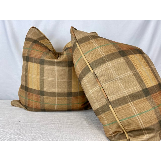 Custom pair of 22" pillows covered in a soft, wool blend fabric printed in a plaid pattern. These pillows are self welted,...