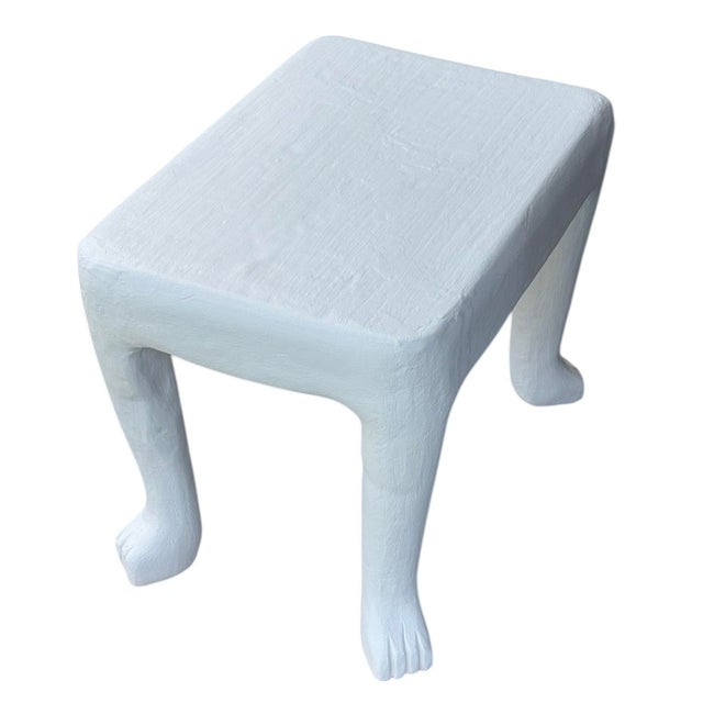 This rectangular table features the handcrafted texture of Dickinson's plaster work as well as the iconic stylized paw...