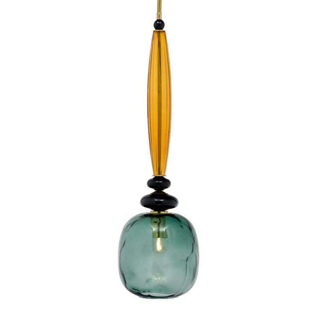 Pair of Murano glass pendants in the style of Ettore Sottsass. This pair includes hand-blown glass elements in a gray and...