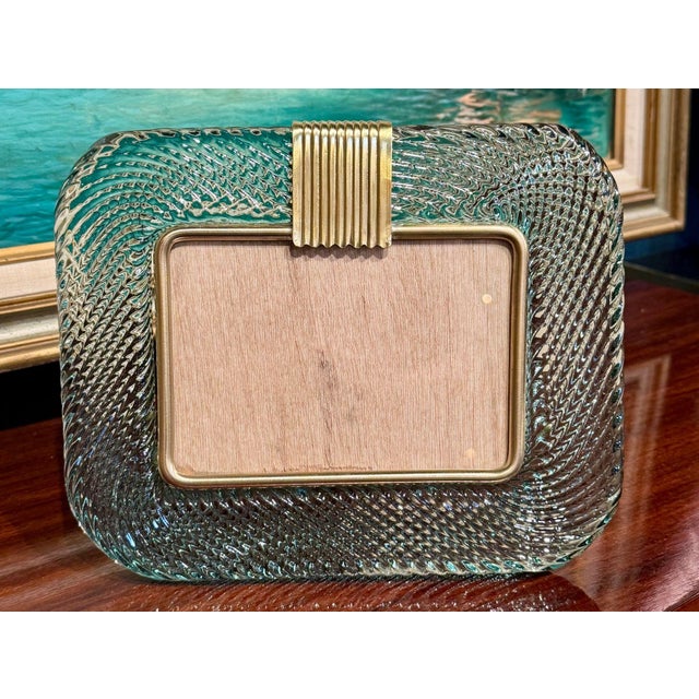 The Italian Murano Fontana Green Picture Frame is a stylish and elegant addition to any home decor. Manufactured in the...
