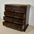 Elegant Spanish chest of drawers crafted in solid oak with strong architectural lines and a richly aged patina. The piece...