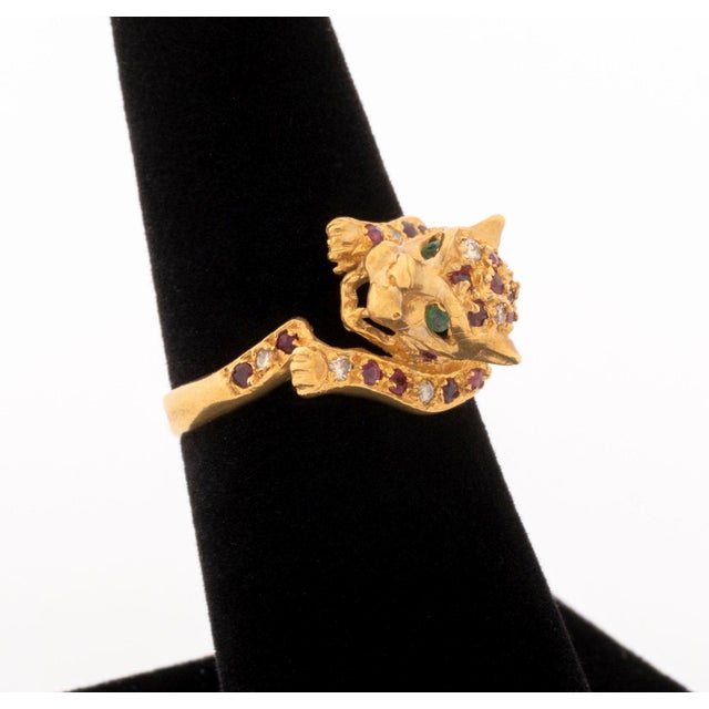 18K Yellow Gold Ruby Diamond Emerald Leopard Ring, featuring thirty six pave set rubies weighing a total of approx. 0.60...