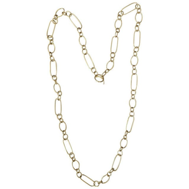 8kt Yellow Gold Paper clip link necklace 36" with hollow rectangle and oval links in a pattern measuring 36" The elegant...