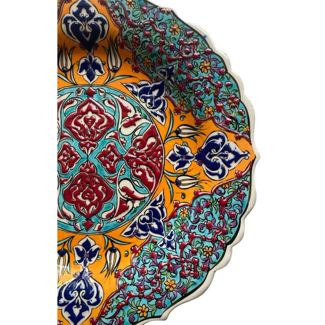 Vibrant example of a traditional Turkish plate with bold red, orange, turquoise, navy blue and white decoration. Floral,...