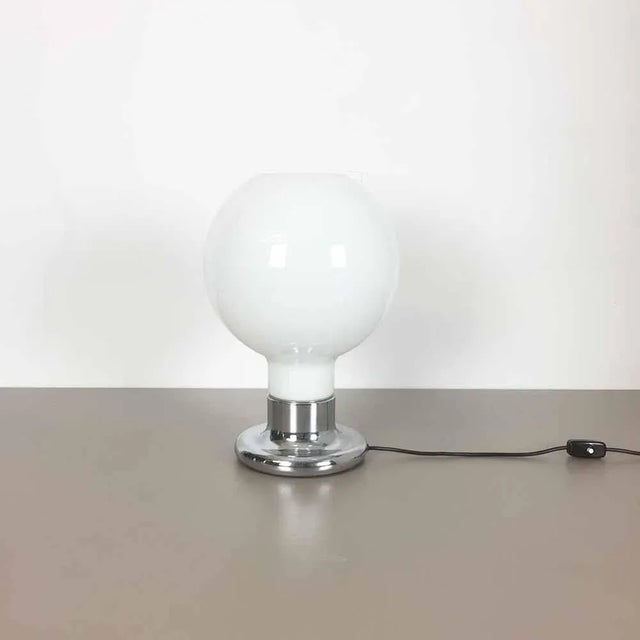 Table light. Producer: Cosack Lights, Germany. 1970s. This original table light with a round glass shade and chromed base...