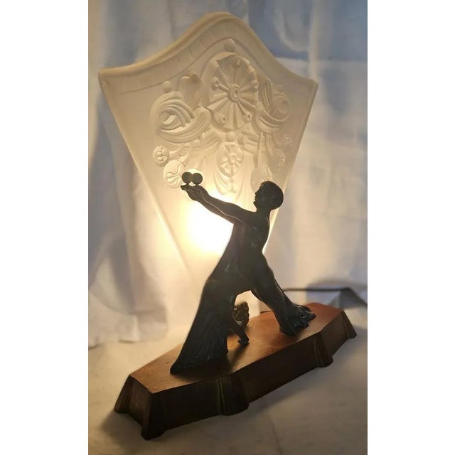 Exceptional art deco lamp depicting a "ball dancer" typical of the 1930s in the style of max le verrier. The spelter...