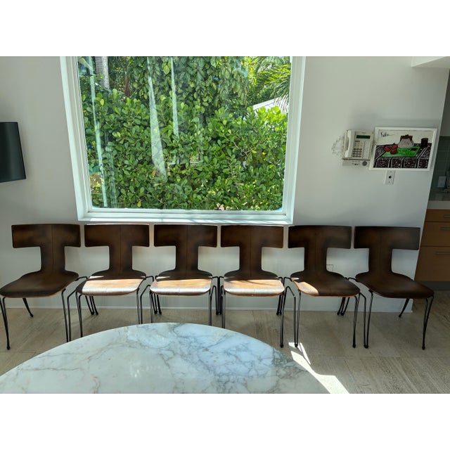 This set of 6 Vintage Donghia "Anziano" brown leather chairs is a great showcase for this iconic minimalist chair's...