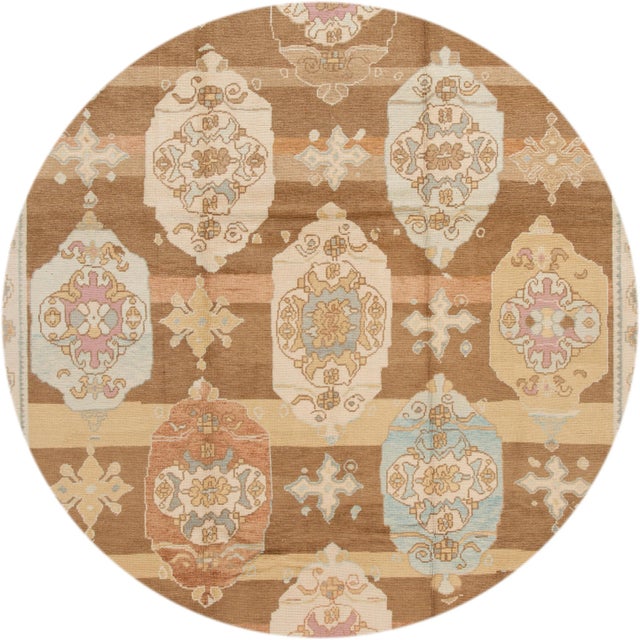 Beautiful contemporary Turkish kars rug, hand knotted wool with an ivory frame and brown field, multi color accents in a...