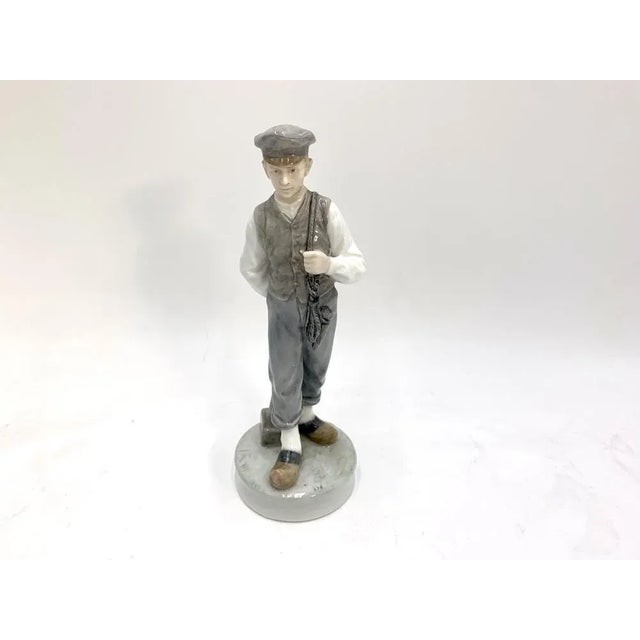 Porcelain Figurine of a Boy With a Hammer from Royal Copenhagen, Denmark, 1945, in Very Good conditions. Designed 1960 to...