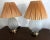 Very groovy and retro, this pair of table lamps features a frosted glass urn in a molded seashell form on polished brass...