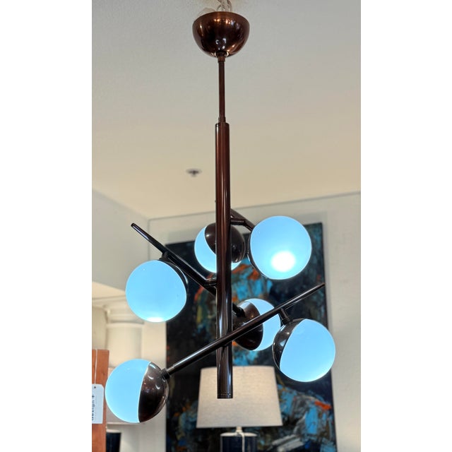 Design Plus Gallery presents the Slim Linkka Chandelier from Arteriors. A unique Sputnik style pendant light. It has six...