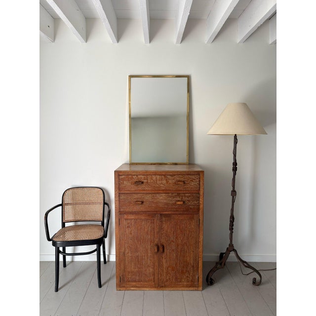 An understated yet stylish vintage wall mirror with a slimline solid brass frame. This rare Mid Century rectangular mirror...