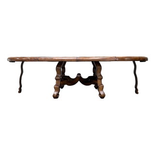 Custom Early Spanish Style Walnut Dining Table – Round to Oval With Leaves, Carved Stretcher Base For Sale