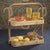 Elevate your serving style with this two-tier rattan tray crafted from handwoven rattan and rattan core. The natural light...