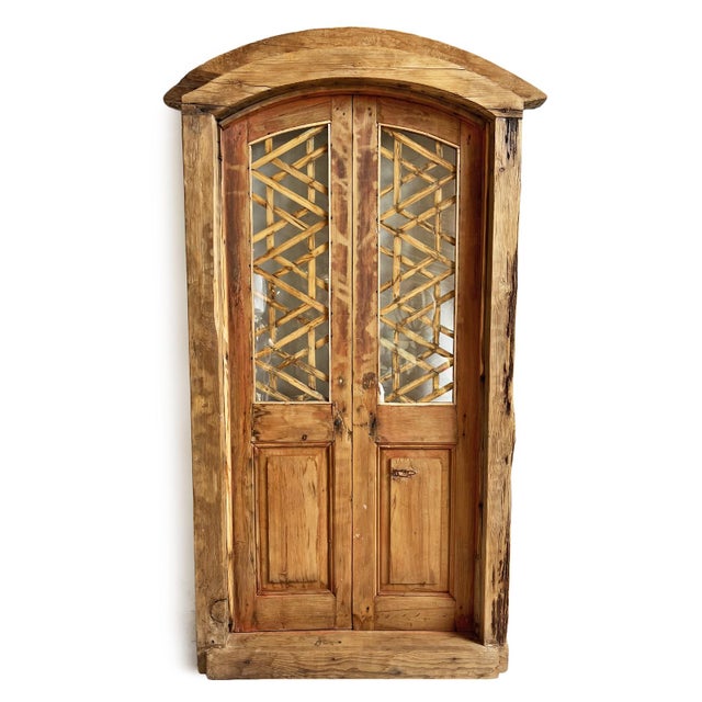 Antique Jodhpur salvaged wood carved shutter doors with glass on each door and arched top. Intricate hand carved details...