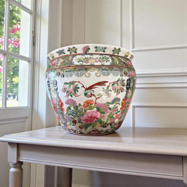 Vintage Chinese porcelain fishbowl planter / cachepot in famille rose style, mid-20th century. Richly decorated with...