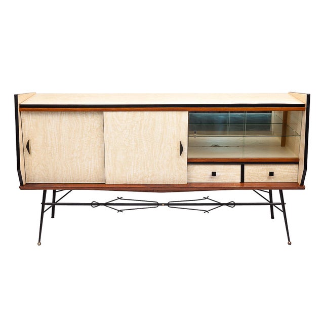 Modern sideboard. Zebrano-effect formica veneer. 2 sliding doors. Brass handles. A display case with glass top. 2 drawers....