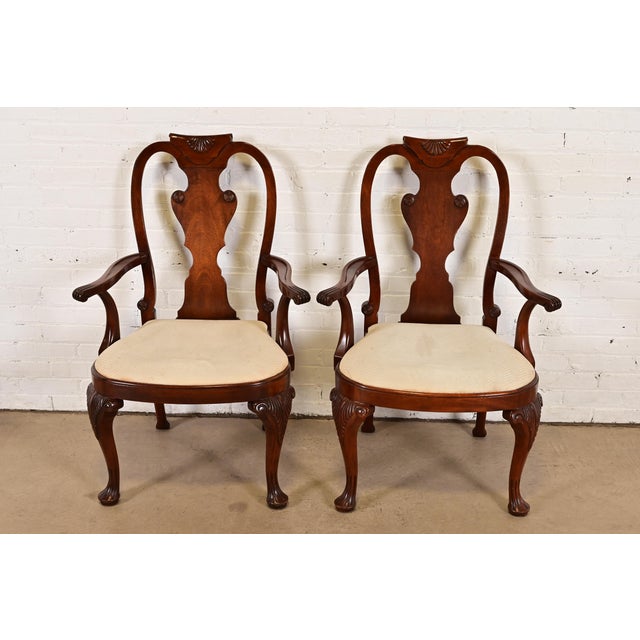 A gorgeous pair of Queen Anne or Georgian style armchairs or dining captain chairs By Baker Furniture USA, Circa 1980s...