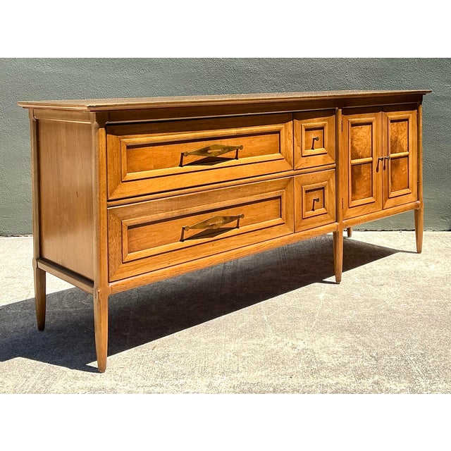 This stunning credenza from the celebrated "Sophisticate" collection by Tomlinson is a masterwork of mid-century American...