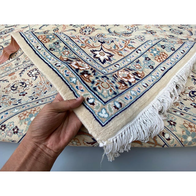 This is a Persian Isfahan rug, renowned for its exceptional craftsmanship and intricate designs. Isfahan rugs are...