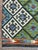 Afghan Kilim rug, hand-knotted in Afghanistan from 100% wool. Measuring 9’10” x 15’5”, the rug features an all-over...
