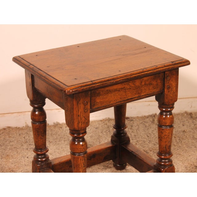 Charming early 19th-century English oak stool in the High Period style. This rare, small stool features a superb turned...