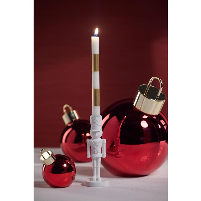 Place a few candles around your home to make the most of the festive season! The nutcracker candle holder has a matte...