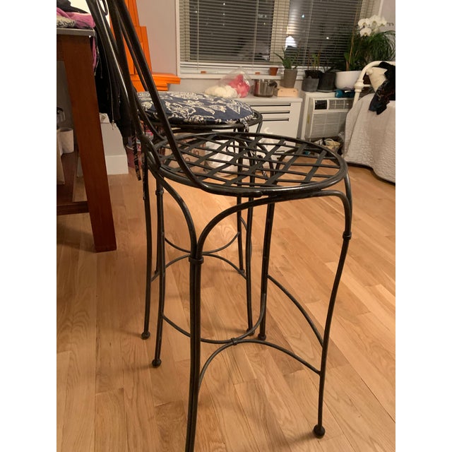 heavy wrought iron bar stools, some wear to metal from use