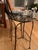 heavy wrought iron bar stools, some wear to metal from use