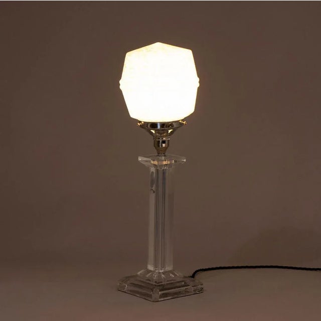 H: 47cm w: 14cm d: 14cm a british art deco table lamp with a clear acrylic base and stem topped with a geometric-shaped...